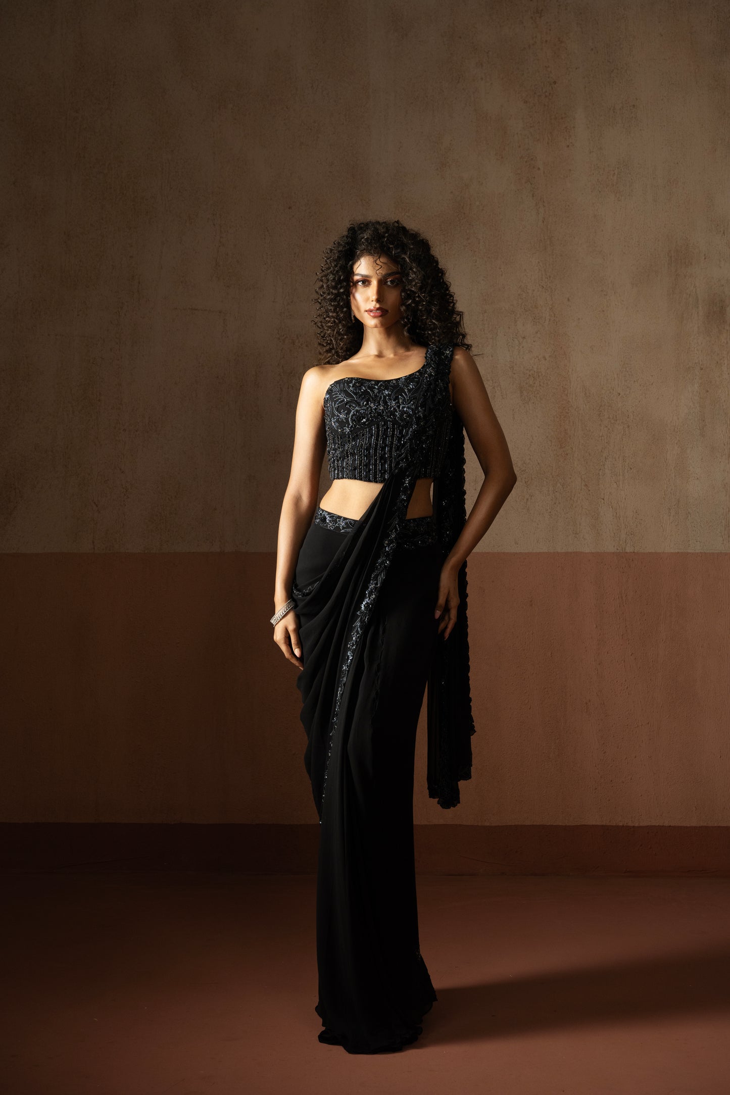 Black one shoulder corset draped saree