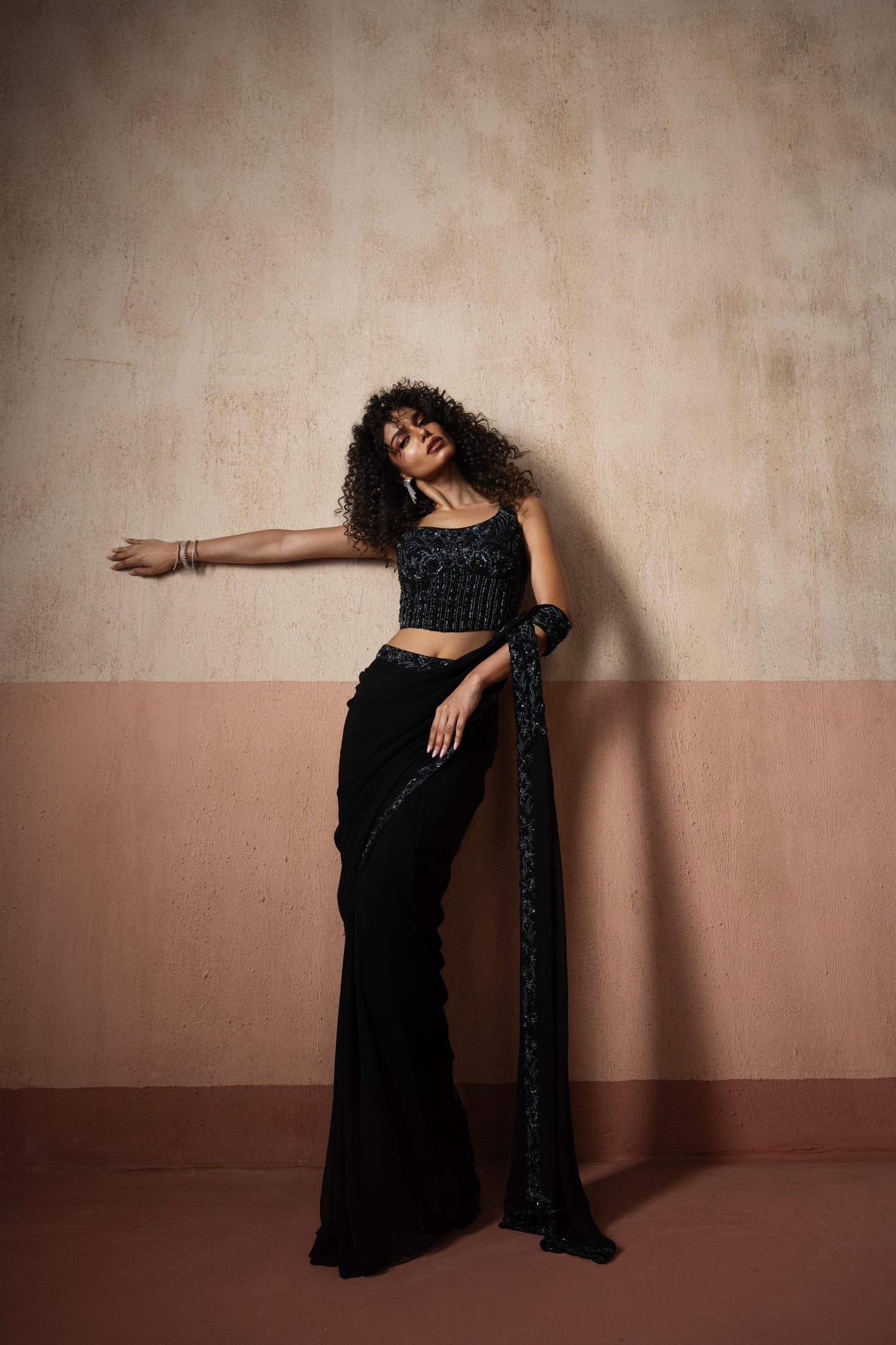Black one shoulder corset draped saree
